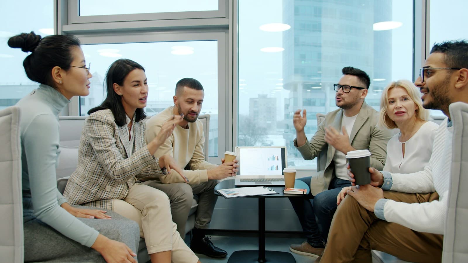 A team discussing ideas around a table in a bright modern office
