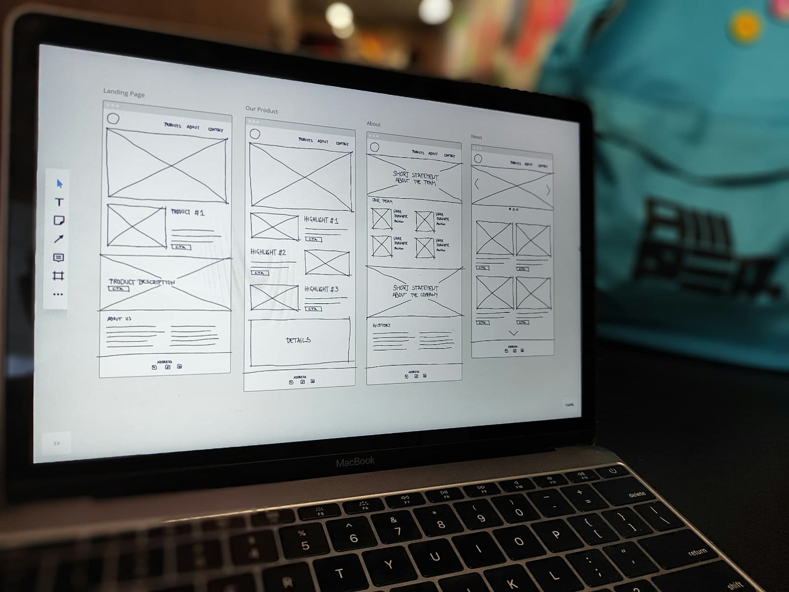 Wireframes for an application open on a laptop screen