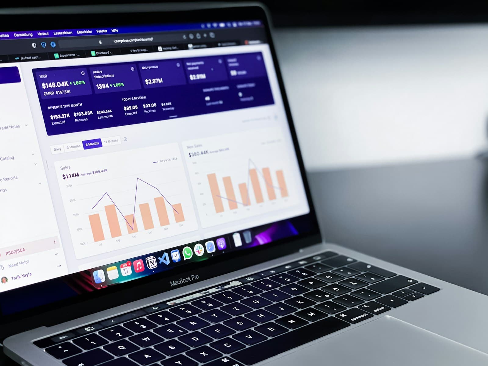A laptop screen showing charts on a cloud management dashboard