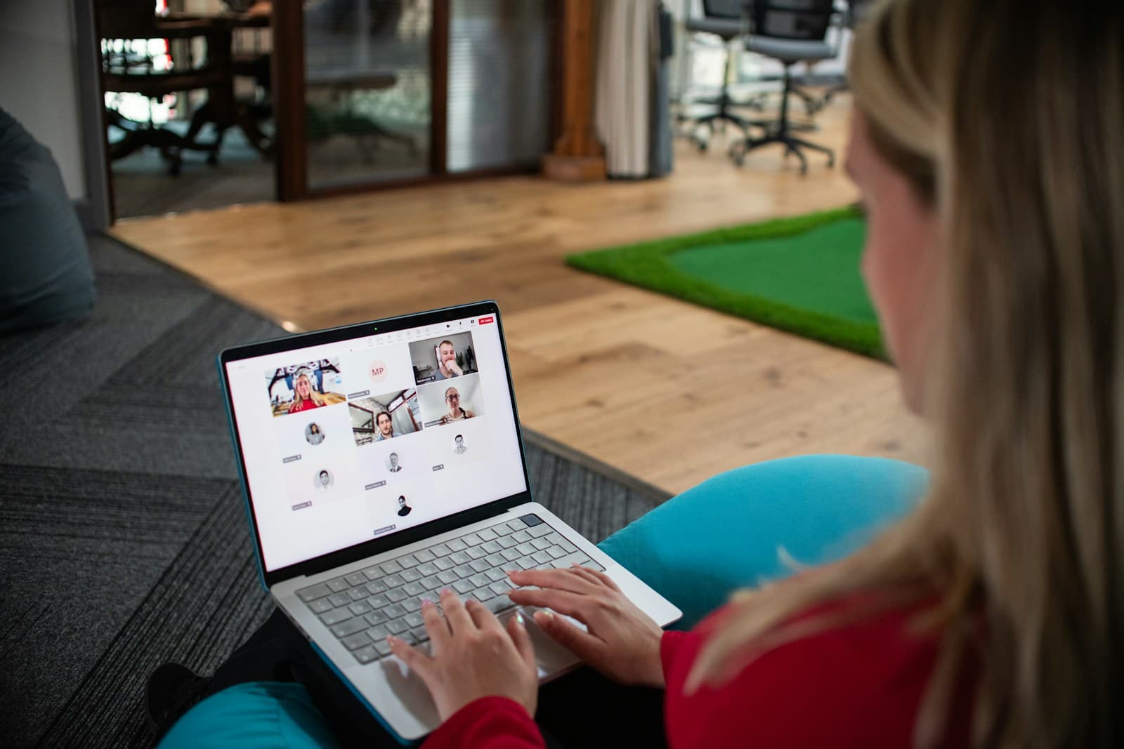 A woman on a video conference call on her laptop